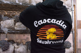 Cascadia Mushrooms hoodie being worn in the mushroom grow room