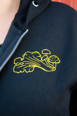 Front detail and logo of Cascadia Mushrooms hoodie